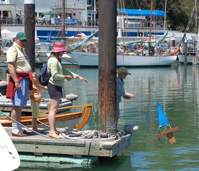 Small boy Launching the model boat