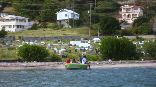 Young guys outside the graveyard in Ashton, Union Island, SVG