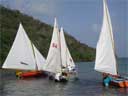 Local boats do a "le Mans" start off the beach